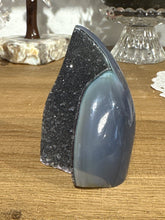 Load image into Gallery viewer, Detail view of polished Brazilian agate flame displaying rich dark banding and moody crystal formations