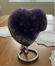 Load image into Gallery viewer, Side view of natural amethyst heart from Artigas showing rich purple crystal points and expert craftsmanship