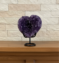Load image into Gallery viewer, Uruguay amethyst heart geode from Artigas with deep purple crystals on black display stand, front view showing natural crystal formation