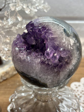 Load image into Gallery viewer, Brazilian amethyst geode sphere showing natural crystal formation and polished exterior