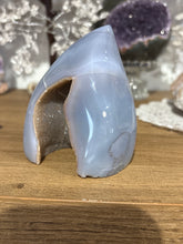 Load image into Gallery viewer, Close-up of Brazilian agate flame showing sparkling crystal-lined cavity and delicate blue-toned natural banding