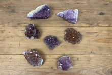Load image into Gallery viewer, Canadian amethyst bulk lot showing variety of colors, crystal arrangements, and hematite inclusions from Thunder Bay, Ontario