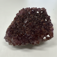 Load image into Gallery viewer, Natural amethyst crystal cluster from Thunder Bay showing purple crystals with golden-brown matrix base and mineral inclusions, side profile view