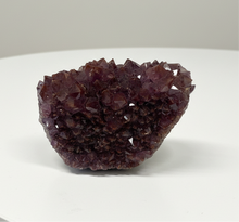 Load image into Gallery viewer, Deep purple Thunder Bay amethyst crystal cluster display specimen with hematite and barite inclusions, top view showing dense crystalline formation