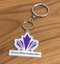 Load image into Gallery viewer, Diamond Willow Amethyst Mine keychain with purple amethyst logo on silver metal