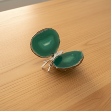 Load image into Gallery viewer, Side view of Brazilian agate butterfly with luminous green banding and natural agate edges, highlighting the silver metal body and polished finish