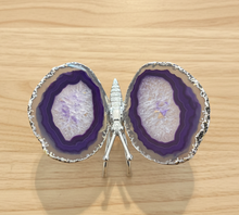 Load image into Gallery viewer, Purple agate butterfly specimen with deep violet banding and sparkling crystal druzy centers displayed on wood table, front view showing natural geode formation