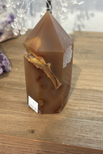 Load image into Gallery viewer, Side view of Brazilian agate tower showing translucent orange-brown body with sparkling druzy crystal formation inside geode cavity