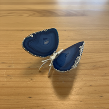 Load image into Gallery viewer, Side view of Brazilian agate butterfly with rich cobalt blue tones and natural crystalline edges, highlighting the silver metal body and polished finish