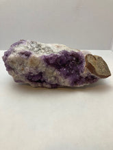 Load image into Gallery viewer, Close-up of chunky amethyst specimen showing purple crystal formations and natural veining patterns