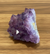Load image into Gallery viewer, Close-up of purple amethyst with metallic hematite accents from Diamond Willow Mine

