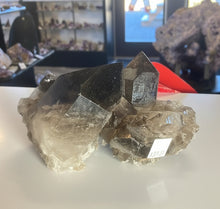 Load image into Gallery viewer, Close up of smokey quartz cluster Brazil showing natural crystal details and healing properties
