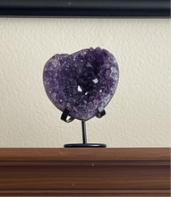 Load image into Gallery viewer, Uruguay amethyst heart geode from Artigas showing detailed purple crystal points and natural heart0shaped formation on display stand

