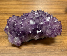 Load image into Gallery viewer, Close-up of purple amethyst crystal with metallic hematite accents

