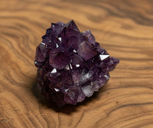 Load image into Gallery viewer, Close-up of natural hematite inclusions in purple Thunder Bay amethyst showing classic characteristics

