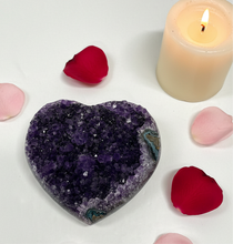 Load image into Gallery viewer, Heart-shaped Uruguay amethyst crystal with deep purple color and small crystal formations on metal display stand
