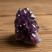 Load image into Gallery viewer, Close-up of natural hematite inclusions in purple Thunder Bay amethyst showing classic characteristics

