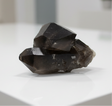 Load image into Gallery viewer, Smokey quartz scepter crystal from Brazil showing massive gem-quality termination with charcoal-black coloring on white coffee table, 13x8x7cm premium specimen
