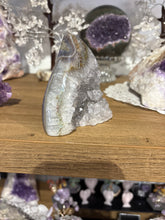 Load image into Gallery viewer, Brazilian agate flame polished specimen with dark grey crystal druzy formations 9cm height and width
