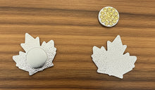 Load image into Gallery viewer, Close-up of Diamond Willow Amethyst Mine refrigerator magnet showing detailed logo

