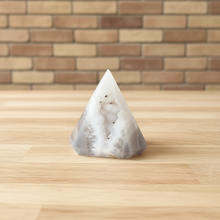 Load image into Gallery viewer, Compact view of white quartz pendulum displaying smooth polished faces and sparkling crystal interior chamber
