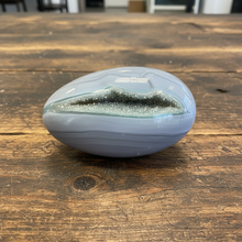 Load image into Gallery viewer, Close-up view of sparkling druzy crystals inside polished agate geode egg from Brazil
