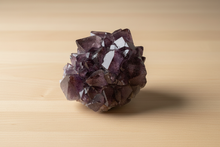 Load image into Gallery viewer, Thunder Bay amethyst on light wood - view 1
