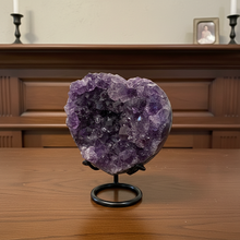Load image into Gallery viewer, Uruguay amethyst heart specimen from Artigas displaying rich purple crystal clusters and natural cavity formation on black stand
